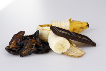 banana plum and chocolate on white