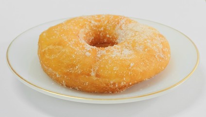 Glazed Donut with Sugar on White Dish