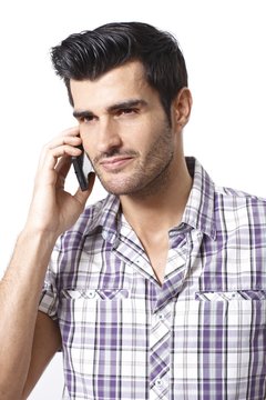 Portrait of young man on mobilephone