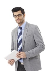 Handsome businessman with tablet