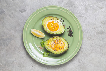 Homemade Organic Egg Baked in Avocado with Salt and Pepper