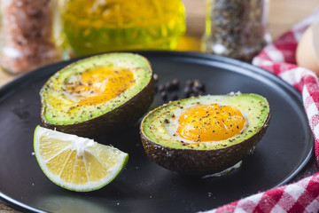 Homemade Organic Egg Baked in Avocado with Salt and Pepper