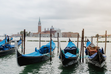 Fototapeta premium Traditional gondolas and San Giorgio Maggiore, Venice Italy