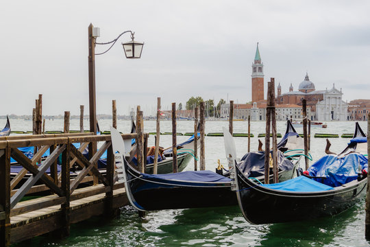 Traditional gondolas and San Giorgio Maggiore, Venice Italy