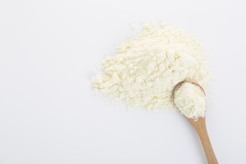 Top view of powdered milk and a spoon.
