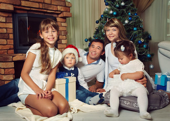 family celebrating Christmas at home