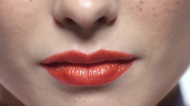 Lips of woman smiling. Red lips macro.