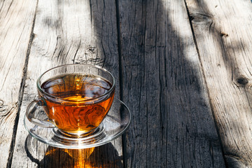 Glass of tea in bright sunlight