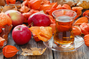 tea cup on table with fall harvest