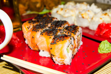 Traditional Japanese food. Fresh sushi at a Japanese restaurant. Japanese food on a wooden table.