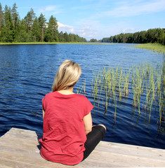 Fototapeta na wymiar Young beautiful woman enjoy the nature of Finland