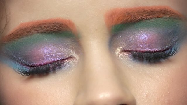 Beautiful eyes, colorful makeup. Green and blue eyeshadow.