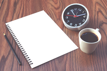 Concept Insights message on notebook with pencil and coffee cup on wooden table.
