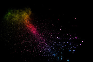 abstract color powder explosion on  black background.abstract  Freeze motion of color powder...
