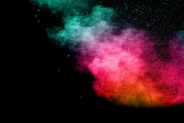 abstract color powder explosion on  black background.abstract  Freeze motion of color powder...