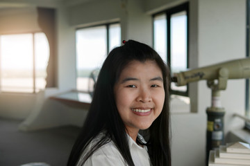 Beautiful Asian Woman Smiling in front of Binoculars on Sky Tower 