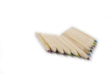 Back to school and classroom supplies with closeup on mix colored pencils on white background