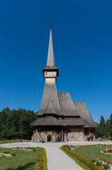 Fototapeta na wymiar The Sapanta Monastery spire. The tallest wooden structure in Europe