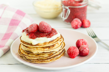 Homemade american pancake with jam and pudding served for breakfast