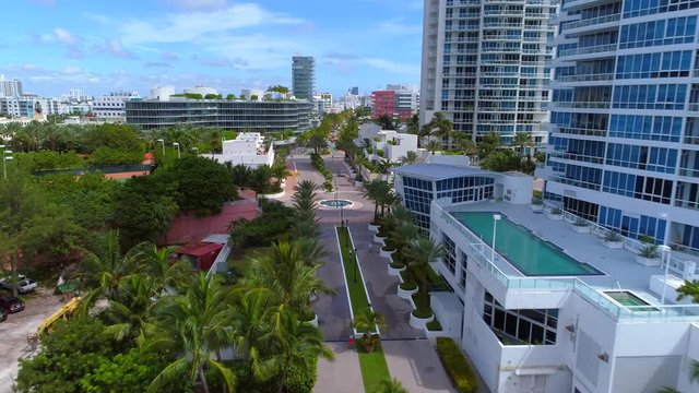 Aerial shot Miami Beach condominiums and palm trees