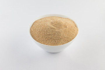 Toasted manioc flour into a bowl