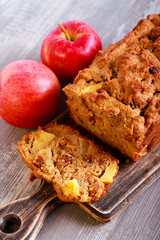 Apple and raisin cake, sliced on board