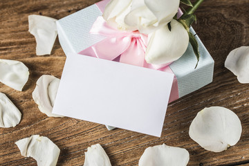Gift roses and blank paper for valentine day holiday