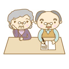 ノートに書くシニア夫婦