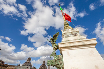 Close up of column of the famous National Monument the Vittoriano or Altare della Patria in Piazza Venezia with italian flag. Rome, Lazio, Italy.