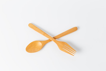 top view wooden spoon and fork on a white background