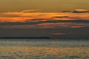 Fototapeta na wymiar Seaside in Lohme with sunset and Kap Arkona on the background, Germany
