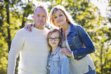 casual young family in the park