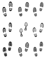Various black prints of shoes on a white background