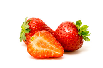 Ripe strawberry on white, closeup.