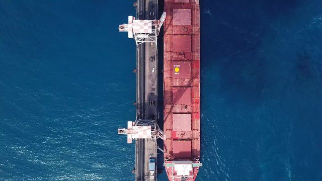 Bulk carrier docked in a Mediterranean port - Top down aerial view