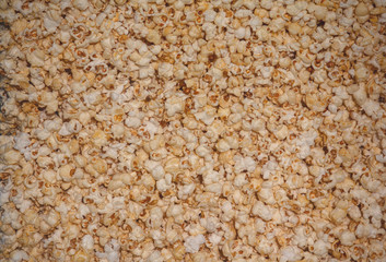 Golden popcorn grains close. Background and textures
