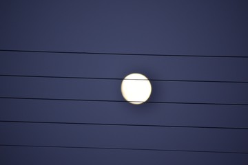 Full moon behind  electric wires.