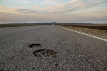 Auto road with two dents, pit