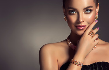 Beautiful girl with jewelry . A set of jewelry for woman ,necklace ,earrings and bracelet. Beauty...