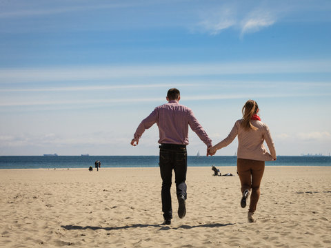 Happy couple having date on beach