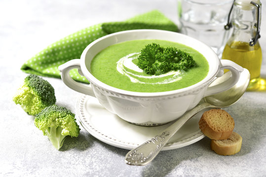 Broccoli soup in a white bowl.