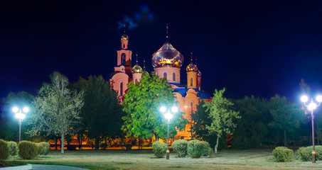 A Panorama of The Church of THE HOLY APOSTLES AND THE GOSPEL JOHN OF BOGHOSLOV in Pokrov city in Ukraire. Panorama of the holy Christian temple in the park at autumn night