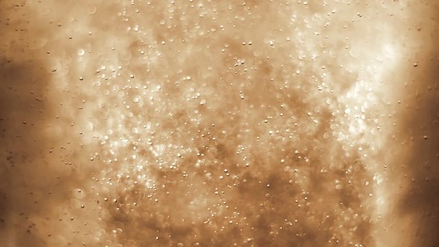 Bubbles floating in the amazing deep structured white gold liquid. Blurred background with dimension. 