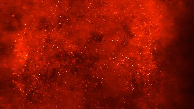Bubbles floating in the amazing deep structured red liquid. Blurred background with dimension. 