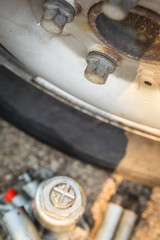 Pneumatic car jack next to old tire