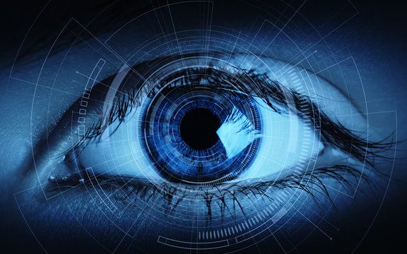 Close up of woman eye in process of scanning. Identification Business Internet Technology Concept