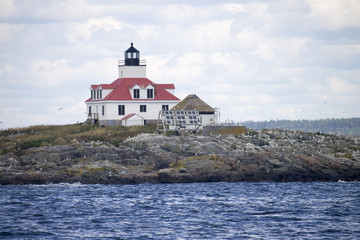 Fototapeta na wymiar Lighthouse on an Island off the Coast of Maine