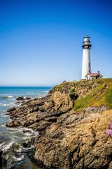 Fototapeta na wymiar Lighthouse standing on big sure california coastline on pacific ocean
