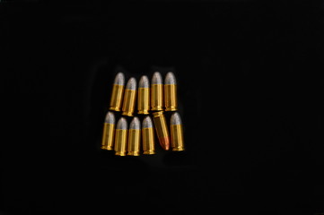 isolated 9 mm gun metal bullet  for war security on black background