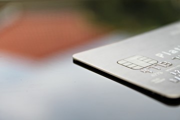 Business, finance, credit card, shopping, saving money, banking, loan, investment, taxes or accounting concept : Credit card on office desk table